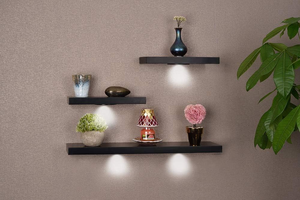 black floating shelves with lights