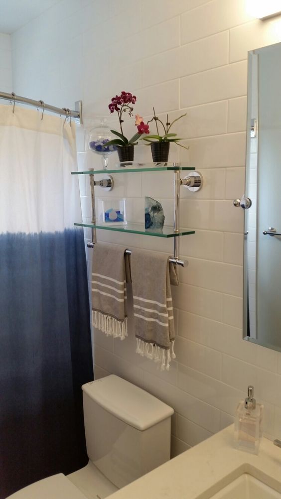 Metal and Glass Shelves over toilet
