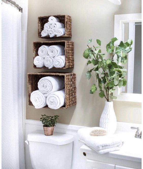 wicker baskets over the toilet wall