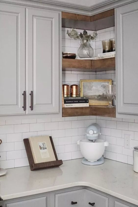 corner floating shelves between cabinets