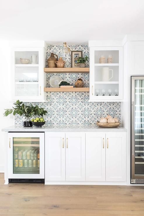 small kitchen floating shelves between cabinets