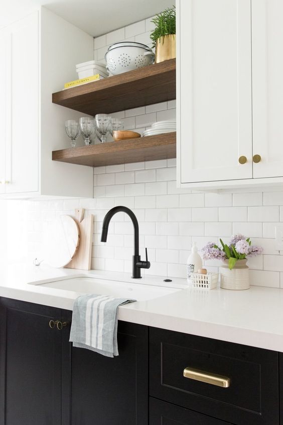 walnut floating shelves between cabinets