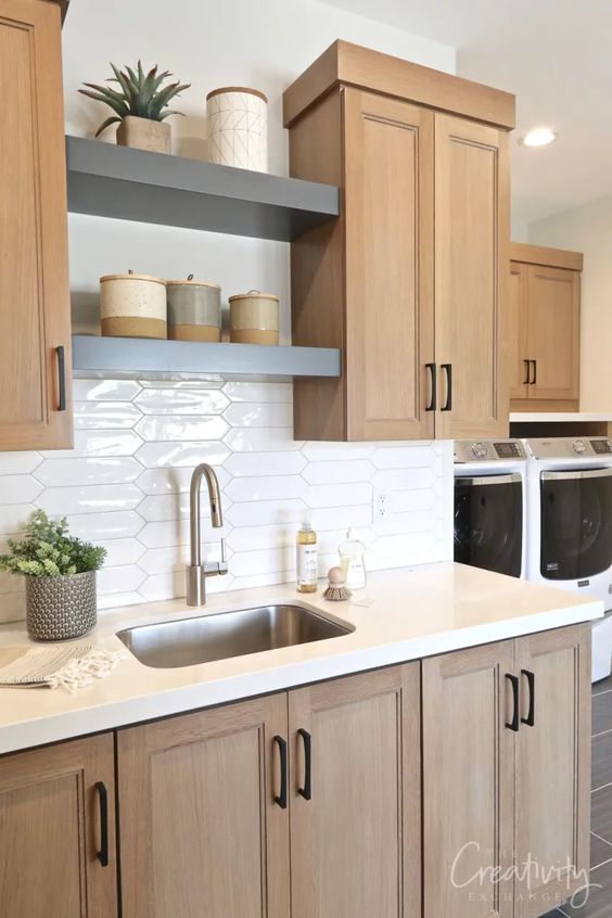 gray floating shelves between cabinets