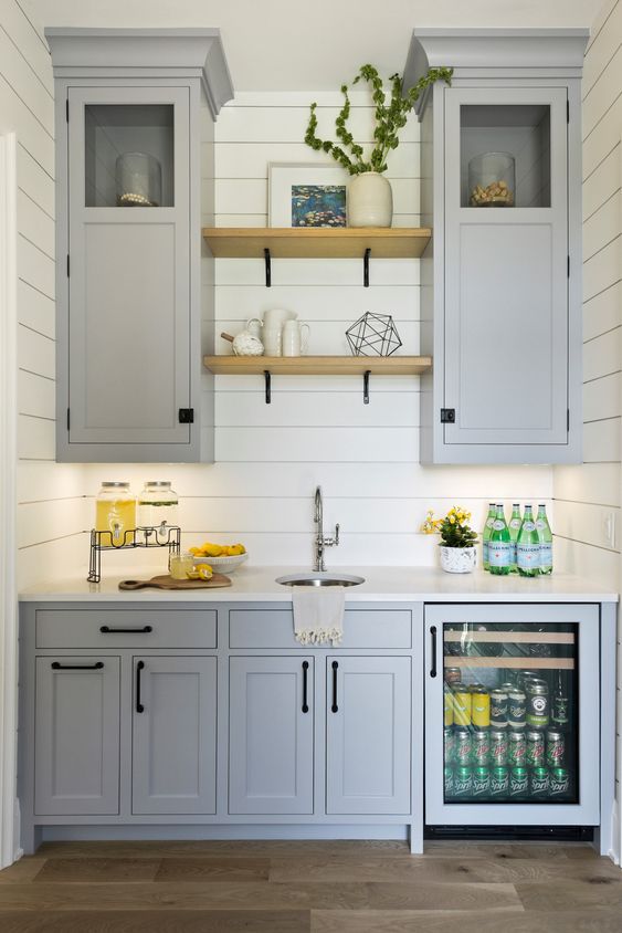 small modern kitchen floating shelves between cabinets