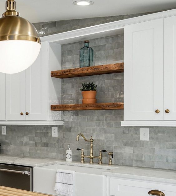 reclaimed wood floating shelves between cabinets