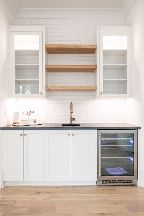 small kitchen floating shelves between cabinets
