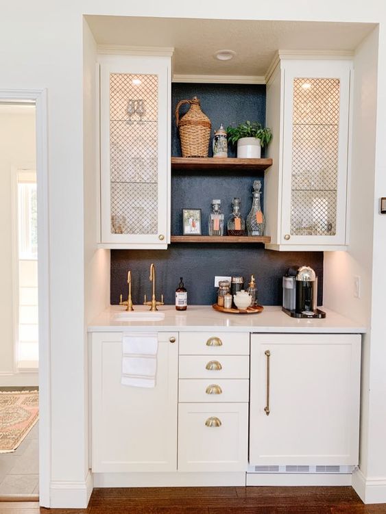 tiny kitchen floating shelves between cabinets