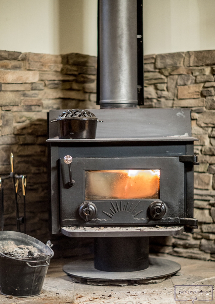 stone accent around wood burning stove