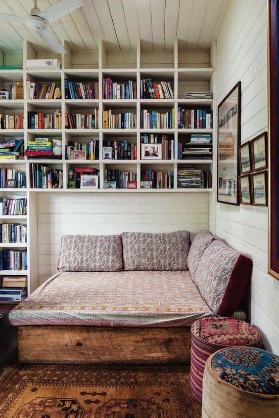 small guest room with vertial storage wall